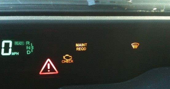 What does it mean when the Toyota Prius red triangle warning light comes on