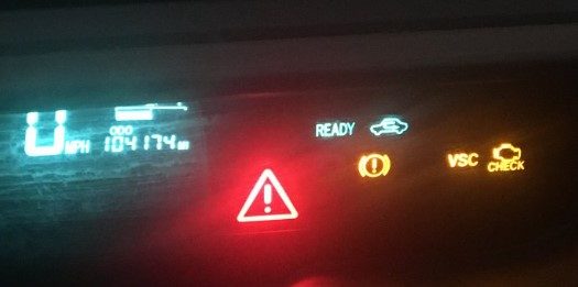 What is the Toyota Prius red triangle warning light