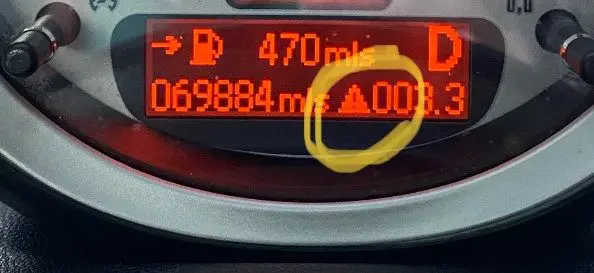 The Meaning of the Yellow Triangle Warning Light on a Mini Cooper