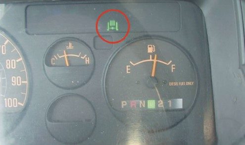 What are the common causes of the Isuzu NPR Exhaust System Warning Light