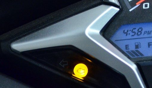 What is the Honda Motorcycle PGM Fi Warning Light